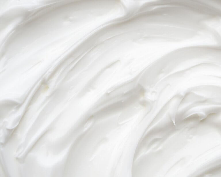Close-up texture of whipped tallow lotion showing creamy, smooth consistency