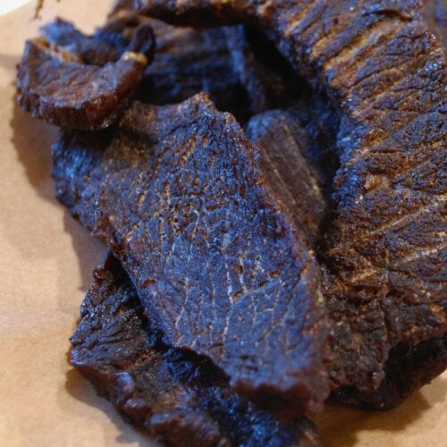 Finished homemade beef jerky made with rump roast, dried until tender and ready to eat.