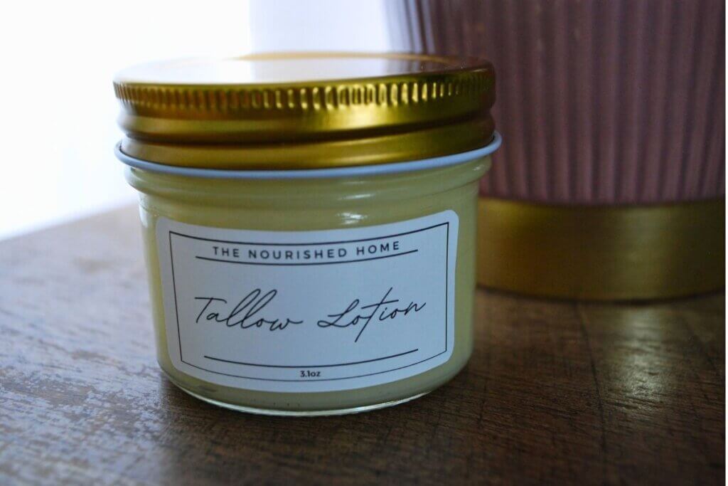 Homemade beef tallow lotion stored in a glass jar for natural skincare