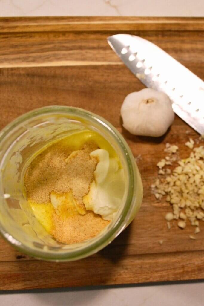 Fresh garlic chopped and prepared for mixing into creamy garlic dip and dressing.