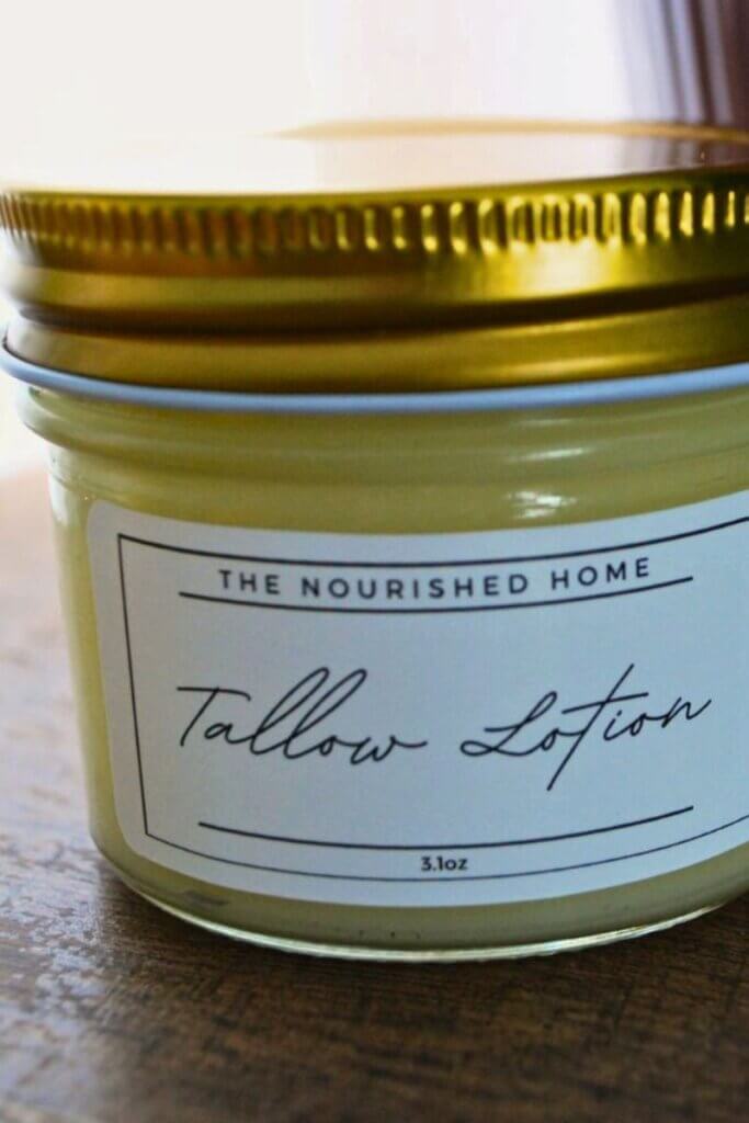 Jar of homemade beef tallow lotion for moisturizing dry hair naturally.