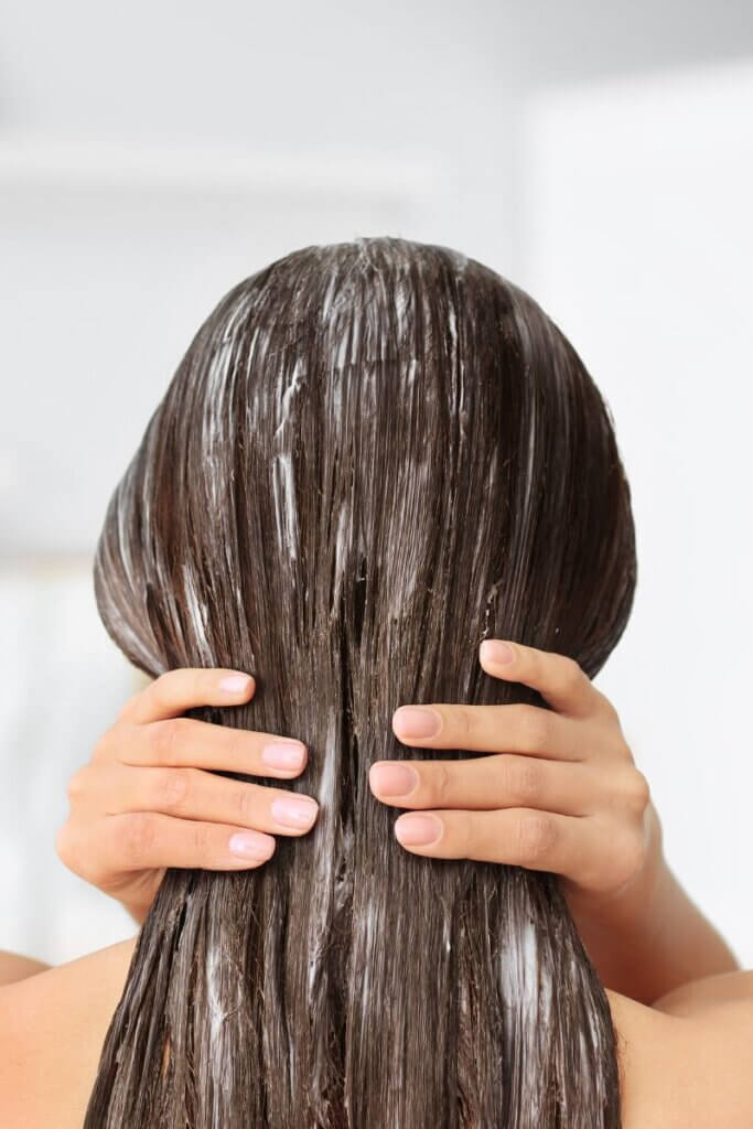 Curly hair that can benefit from a moisturizing beef tallow hair treatment.